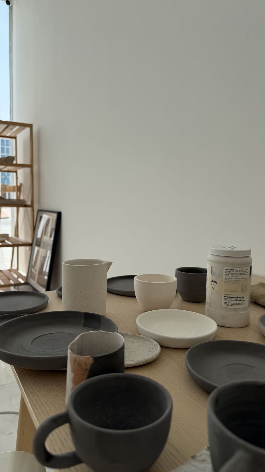 Dark glazed handmade plates and bowls from a ROA Art bespoke order